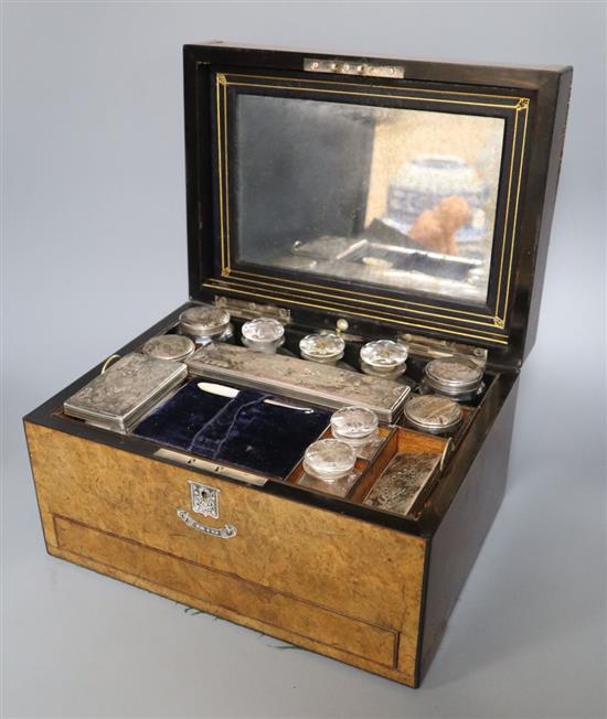 A Victorian walnut and abalone-inlaid toilet box containing plate-mounted fitments, 31cm wide